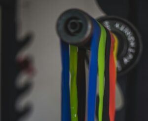 Exercise band hanging over an exercise bar